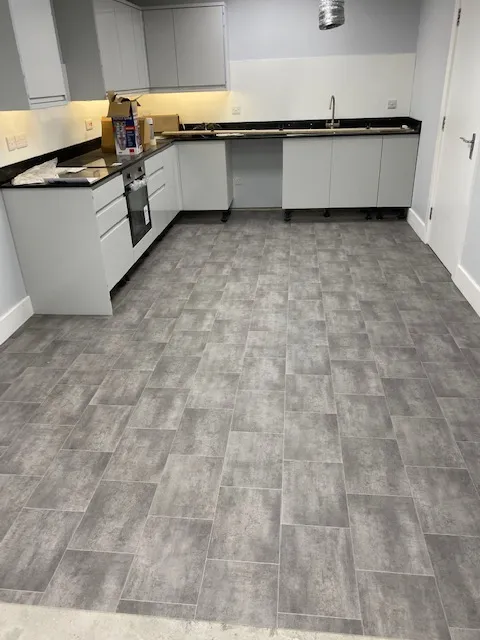 A kitchen with a stove top oven sitting inside of it.