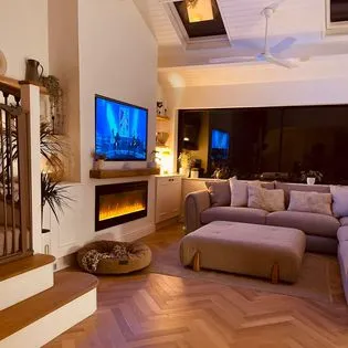A living room filled with furniture and a flat screen tv.